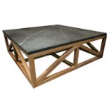 A large grey marble topped white oak coffee table of square form. With "joined" openwork base.135 cm