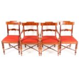 A set of four Scottish Regency mahogany dining chairs. With broad, shaped cresting rails over