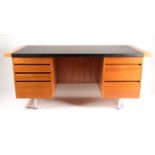 An Evans of London 1970s designer teakwood pedestal desk. With black vinyl, inset top fitted seven
