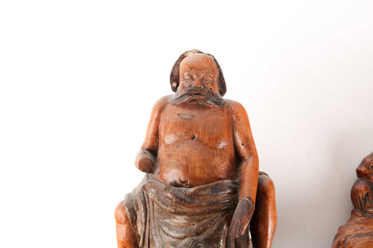 A Chinese root carving of a drunken scholar, Qing, 19th century, carved holding a cup whilst resting - Image 4 of 5