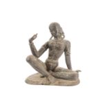 A patinated bronze figure of Parvati (?) Seated at ease with hands in the vitarka mudra on a