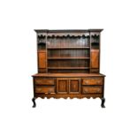 A George III style mahogany crossbanded dresser and rack. The upper section with open shelves and