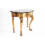 An Italianate marble-topped carved wood and gilt gesso serpentine console table with a single frieze