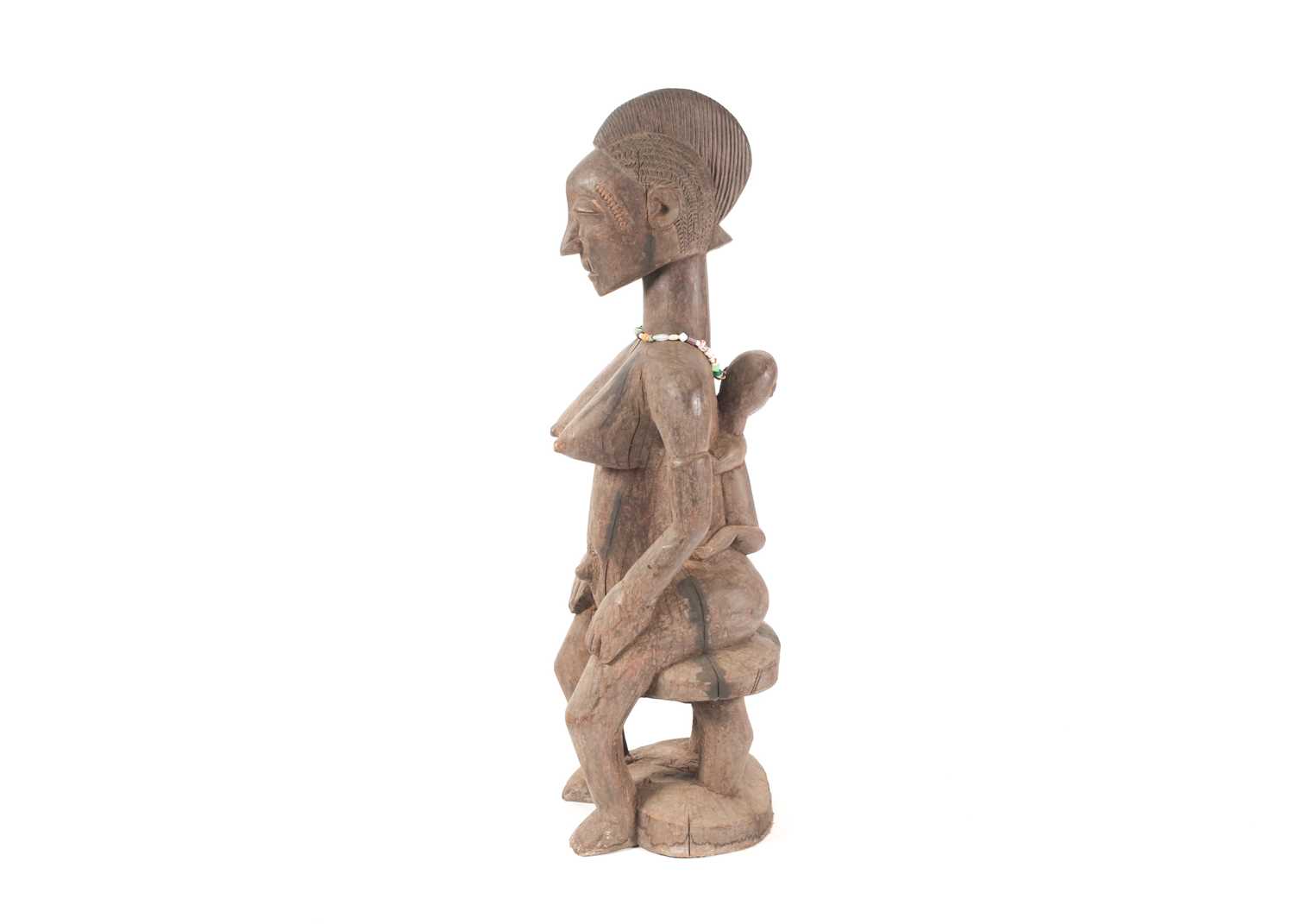 A Baule seated maternity figure, Ivory Coast, with linear and chevron coiffure, scarifications - Image 4 of 4