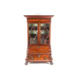 A Chippendale style miniature mahogany bombe bureau bookcase. The upper section with arcaded
