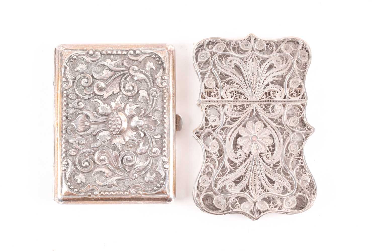 An Indian filigree white metal card case and a Tibetan white metal cheroot case, each with floral