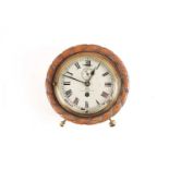An Edwardian eight-day wall timepiece in a carved oak circular rope twist case. Fitted with a Dent