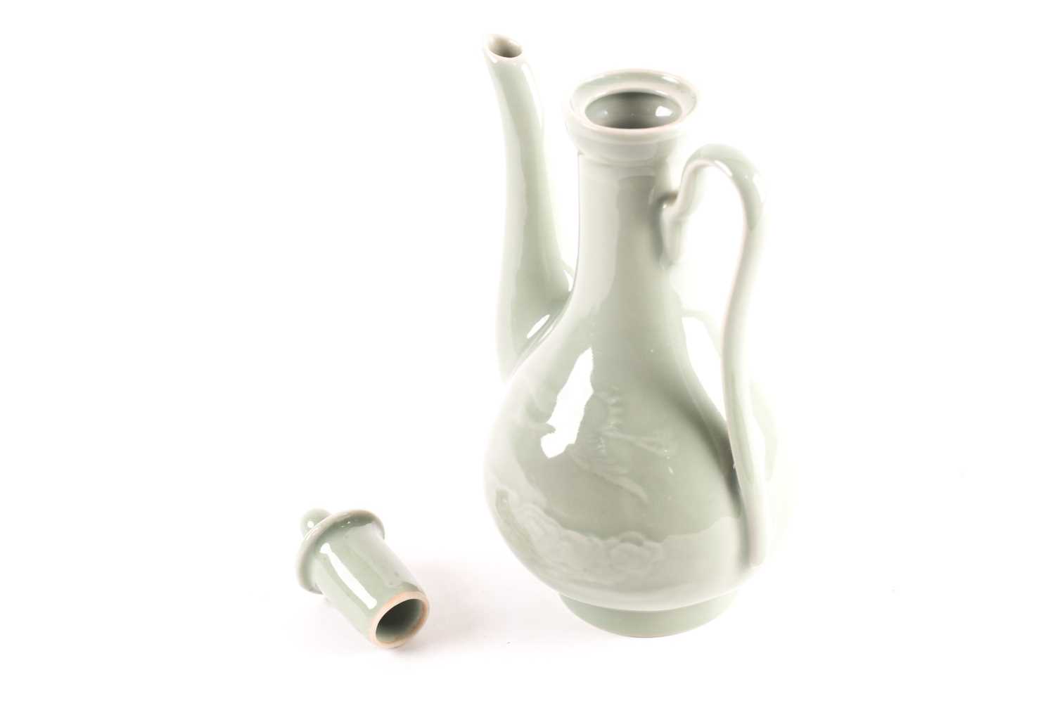 A Chinese celadon wine ewer, modelled in the Persian style, the long stopper with ball knop, moulded - Image 4 of 15