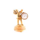 A late 19th century gilt bronze boudoir clock, modelled as a cherub holding a beater and cymbals,