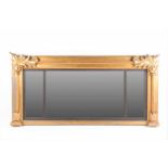 A large 19th-century rectangular triple-section carved wood and gilt gesso overmantle mirror. With