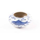 A Chinese blue & white brush washer, of shallow circular form, painted with fish amongst plants,