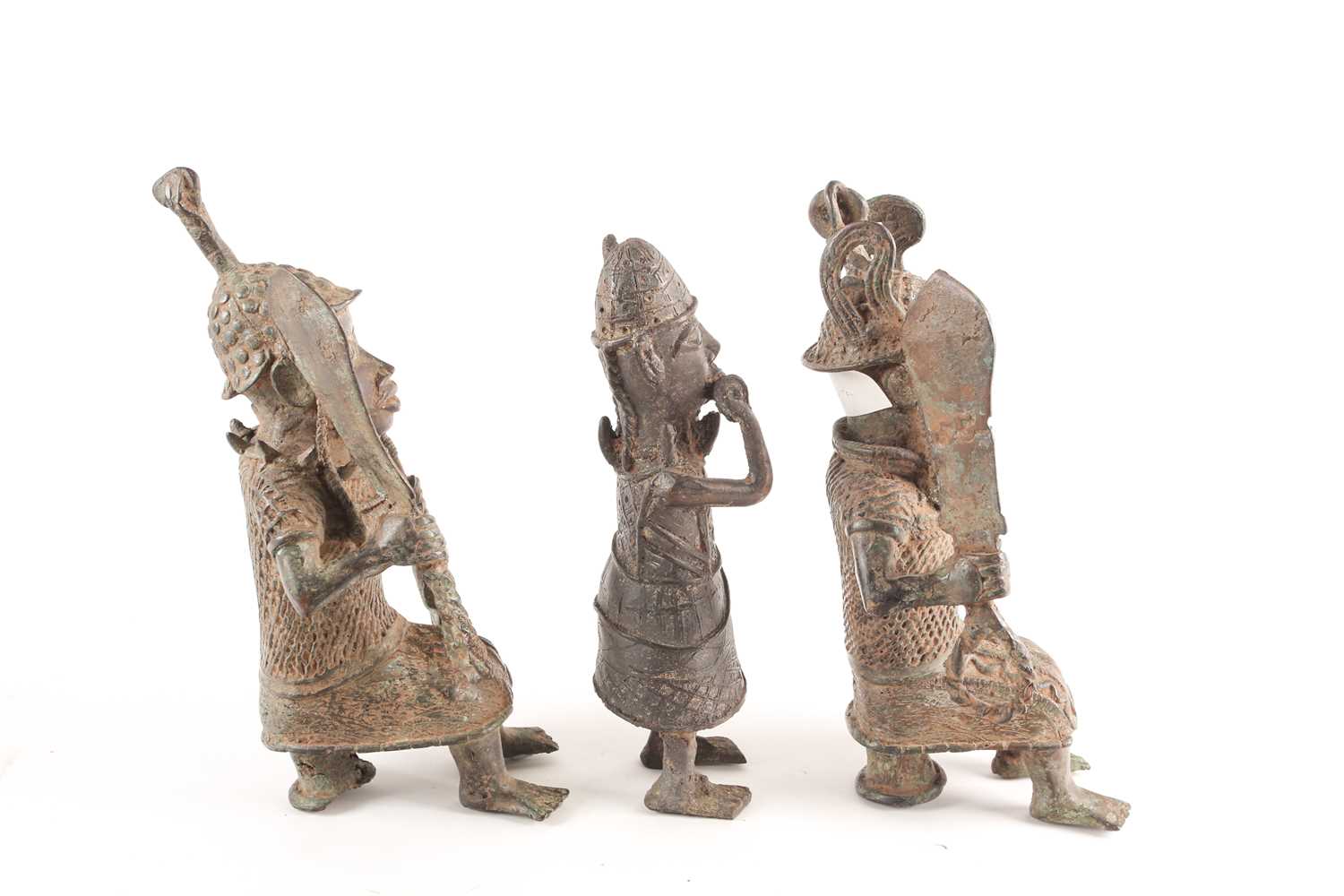 A pair near of Benin bronze seated warriors, Nigeria, each holding a sword and spear, 29.5cm & 30cm; - Image 4 of 7