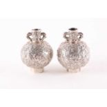 A pair of early 20th Chinese Wang Hing silver miniature two-handled globular vases. Decorated