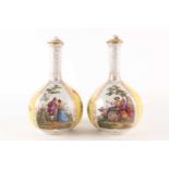 A pair of late 19th century Meissen bottle vases and covers with alternating panels of cut blooms on
