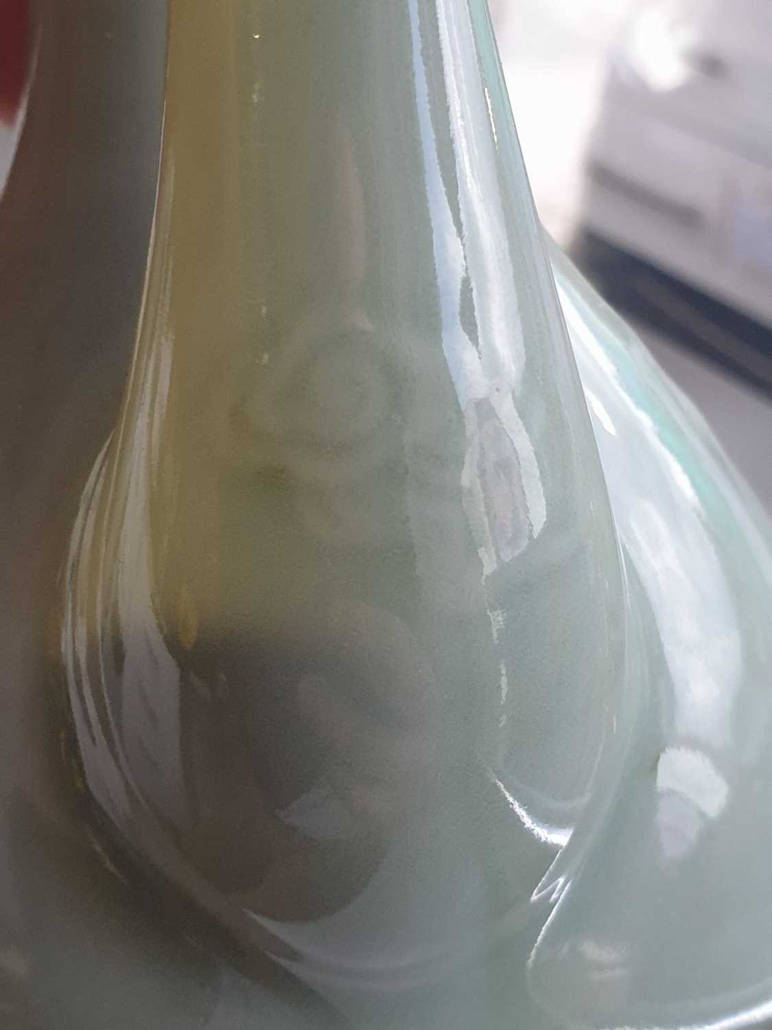 A Chinese celadon wine ewer, modelled in the Persian style, the long stopper with ball knop, moulded - Image 11 of 15