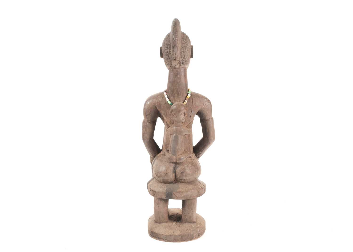 A Baule seated maternity figure, Ivory Coast, with linear and chevron coiffure, scarifications - Image 2 of 4