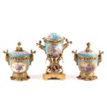 A 19th century ormolu-mounted Sevres bleu celeste urn and cover. Painted with bucolic landscapes and