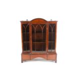 A 19th century mahogany miniature breakfront bookcase, with arched top over three astral glazed