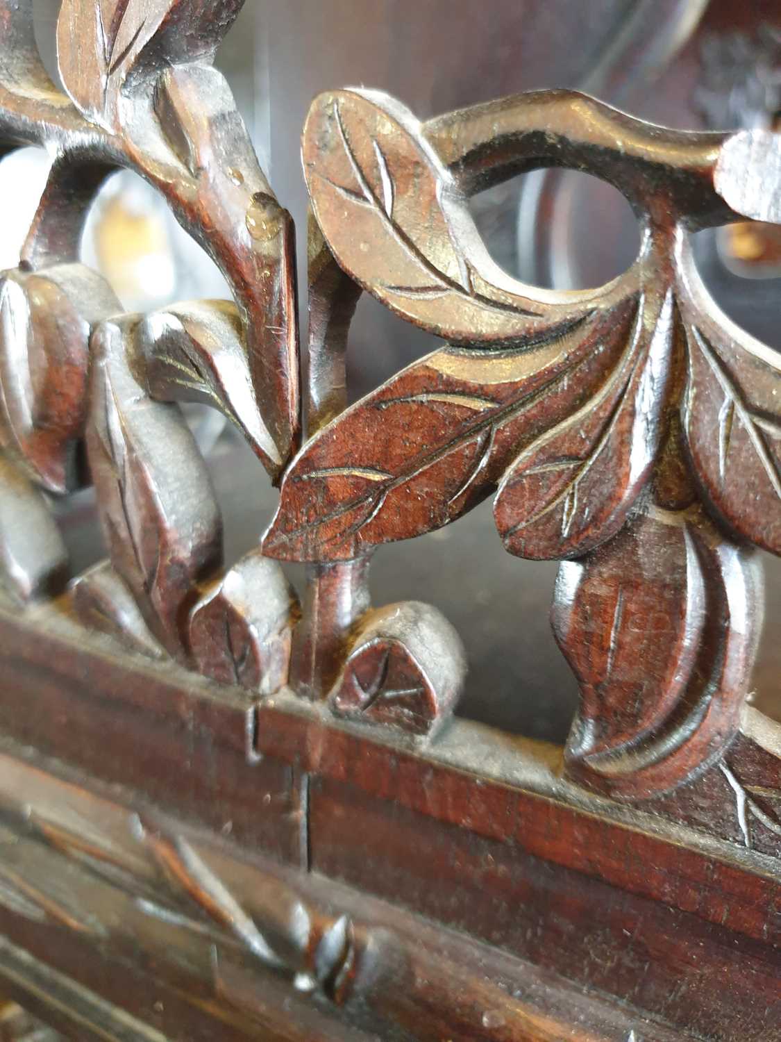 A Chinese hongmu open cabinet, early 20th century, carved throughout with Dogs of Fo, fruiting - Image 13 of 22