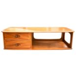 An Ercol golden dawn light elm lozenge form coffee table fitted two short drawers. 125 cm long x