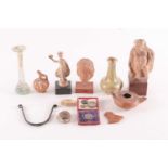 A small group of antiquities and cabinet curiosities including an ancient Greek pottery figure of