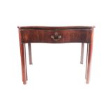 A George III inlaid mahogany gentleman's serpentine, sliding, writing desk/ dressing table. The