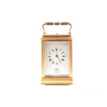 A brass gourge case carriage clock, c1900, strikiing on the hour and half hour, with alarm and