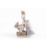 A Lladro figure 'Baby's First Outing', designed by Salvador Debon, model number 4938,