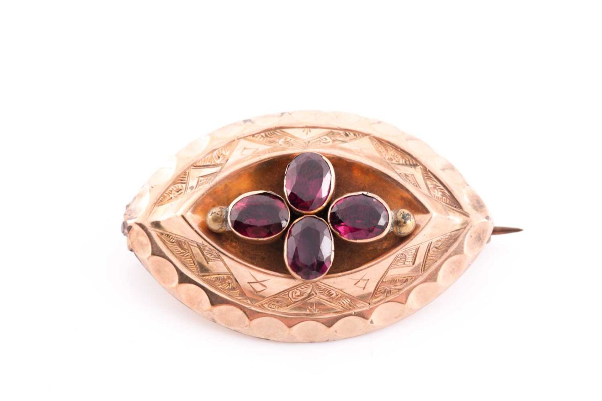 A Victorian yellow gold and garnet brooch, set with four mixed oval-cut garnets, with vacant glass