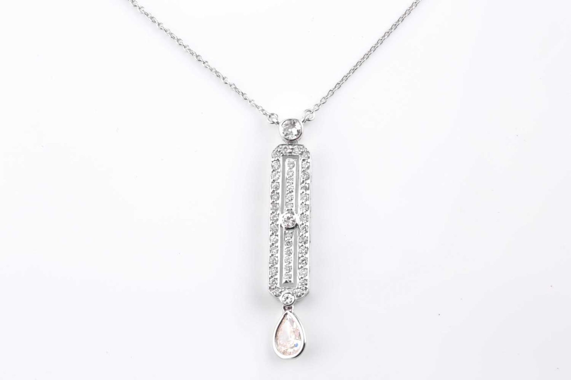 An 18ct white gold and diamond drop pendant, in the Art Deco style, set with a mixed pear-cut - Image 3 of 5