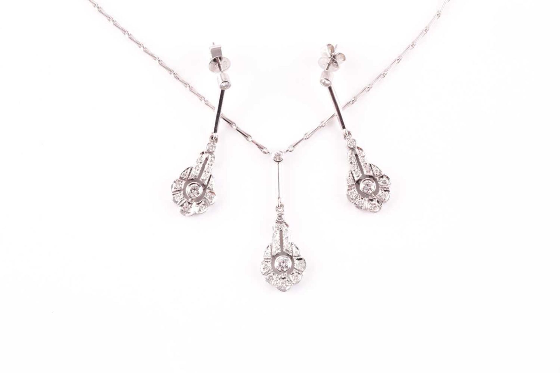 An 18ct white gold and diamond drop pendant necklace, set with round-cut diamonds, pendant 3.2 cm