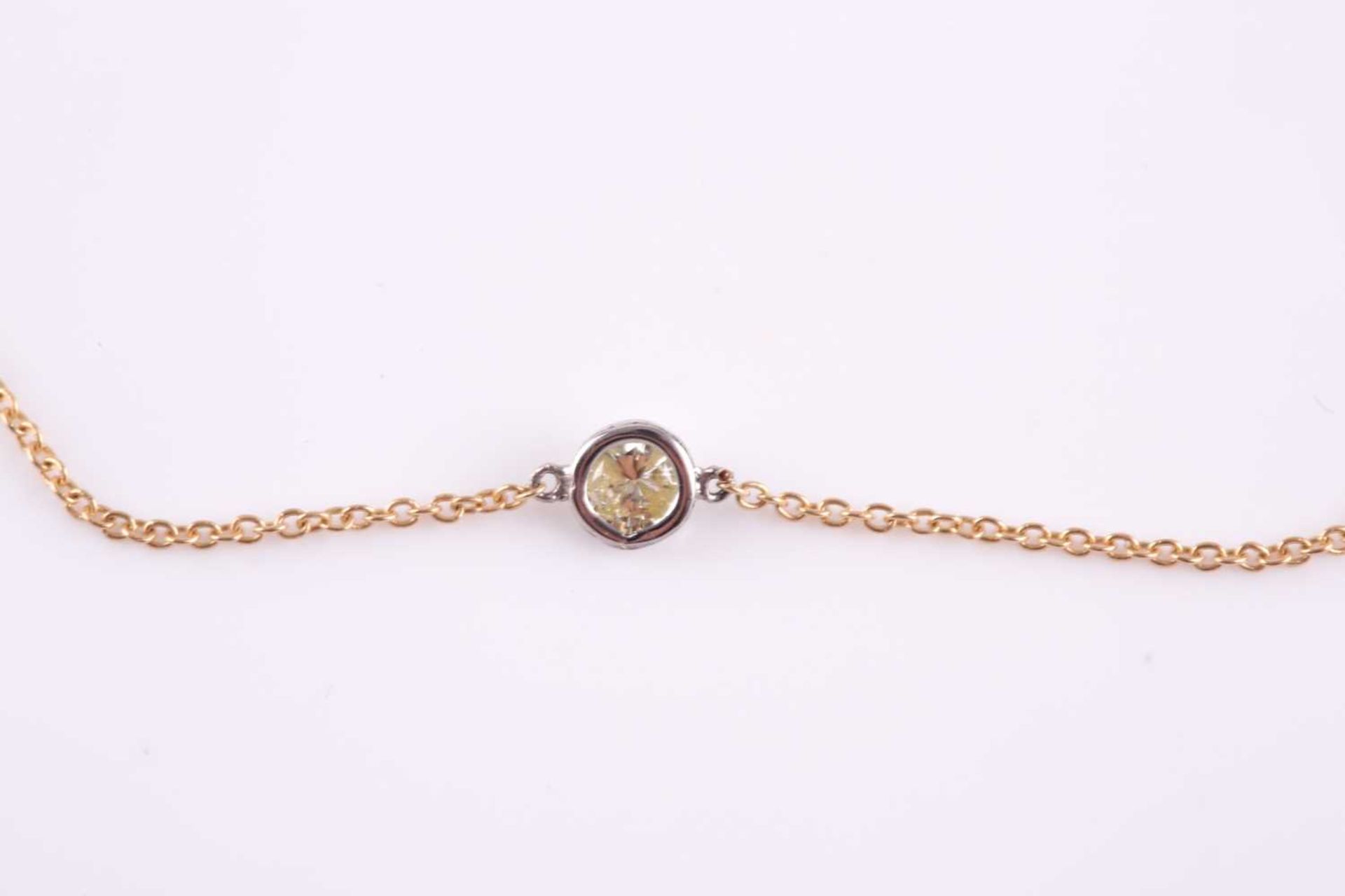 An 18ct yellow gold and diamond necklace, the chain set with a collet-mounted round brilliant-cut - Image 3 of 3