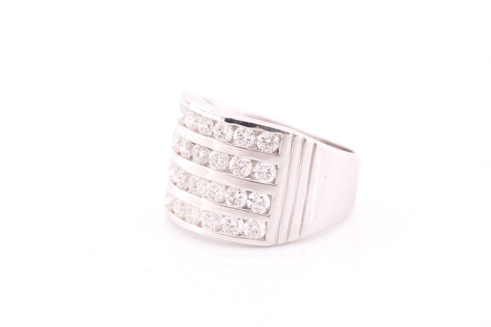 A diamond band ring, channel-set with four rows of round brilliant-cut diamonds of approximately 2. - Image 3 of 4