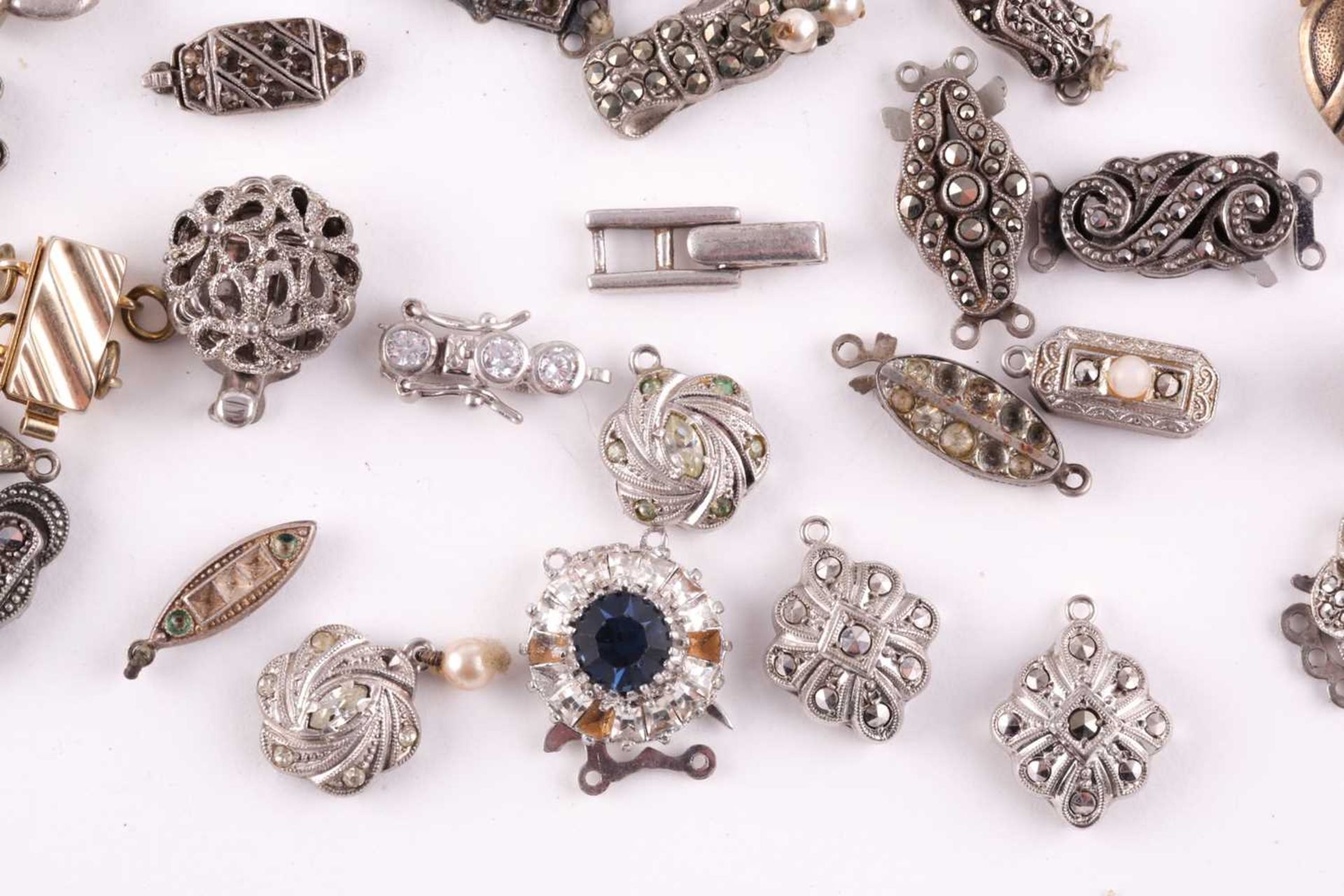 A mixed group of various silver and marcasite set necklace clasps, of various designs and sizes. - Image 5 of 5