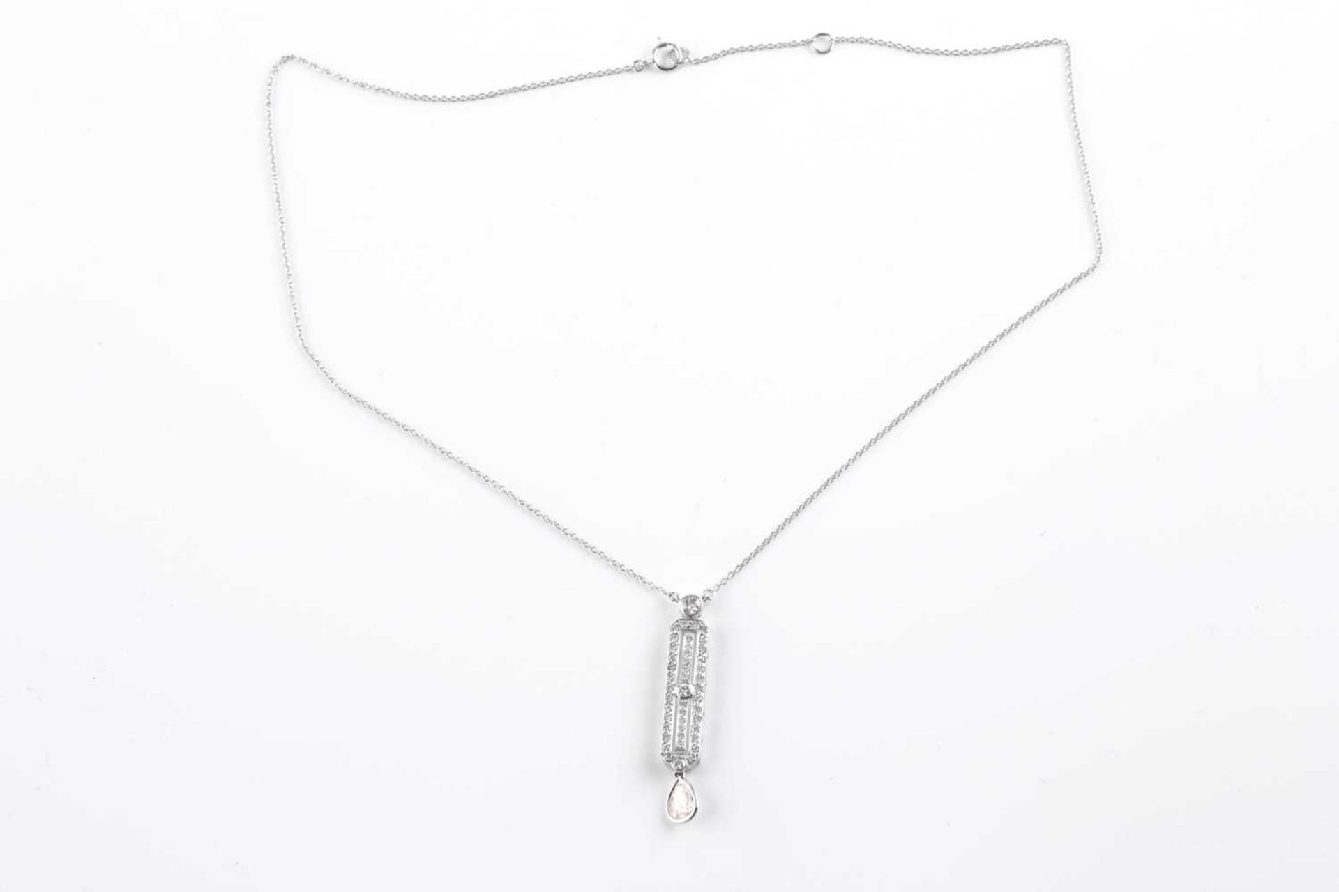 An 18ct white gold and diamond drop pendant, in the Art Deco style, set with a mixed pear-cut - Image 2 of 5