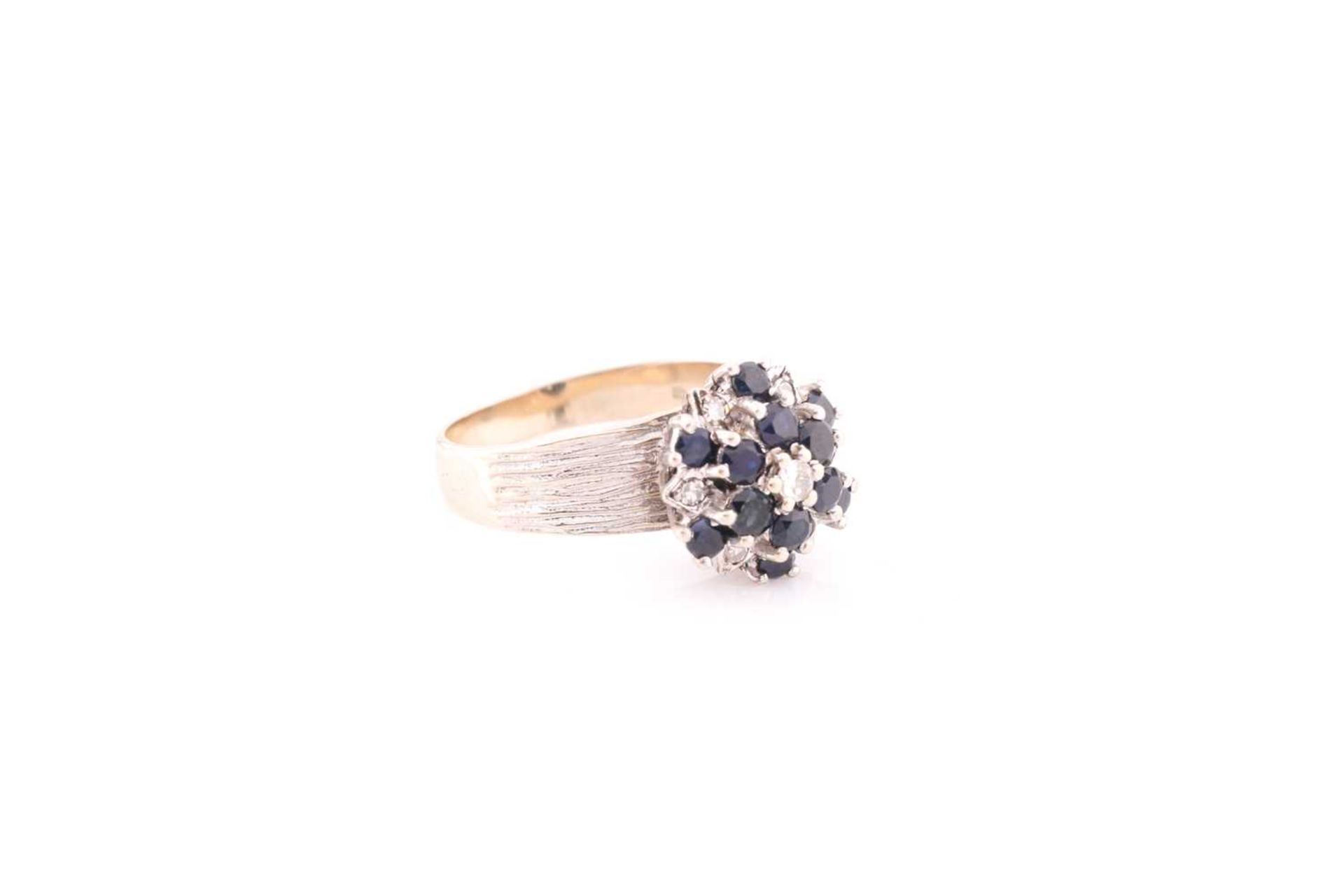 An 18ct white gold, diamond, and sapphire cluster ring, set with a cluster of round-cut sapphires - Image 2 of 4