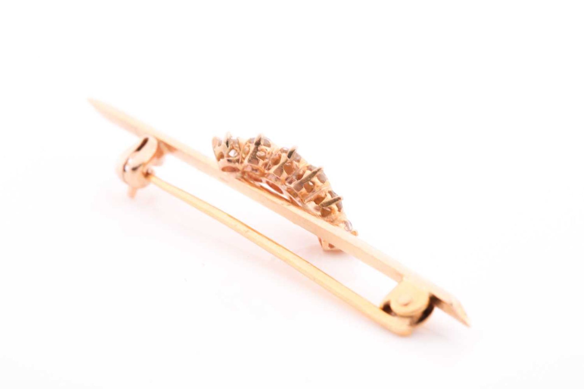 A yellow metal and diamond bar brooch, set with ten round brilliant-cut diamonds of approximately - Image 2 of 3