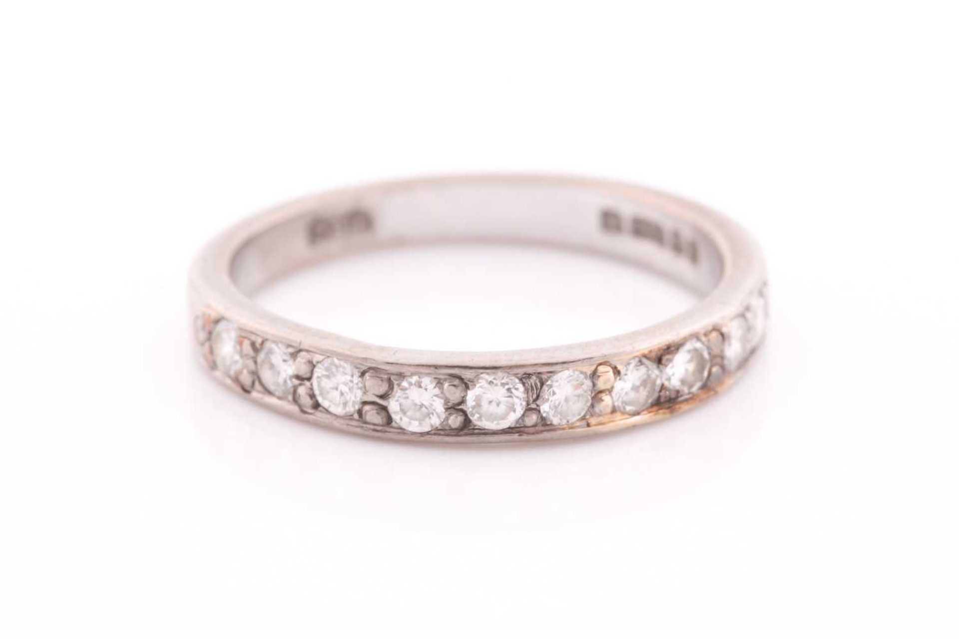 An 18ct white gold and diamond half eternity ring, set with ten round-cut diamonds of