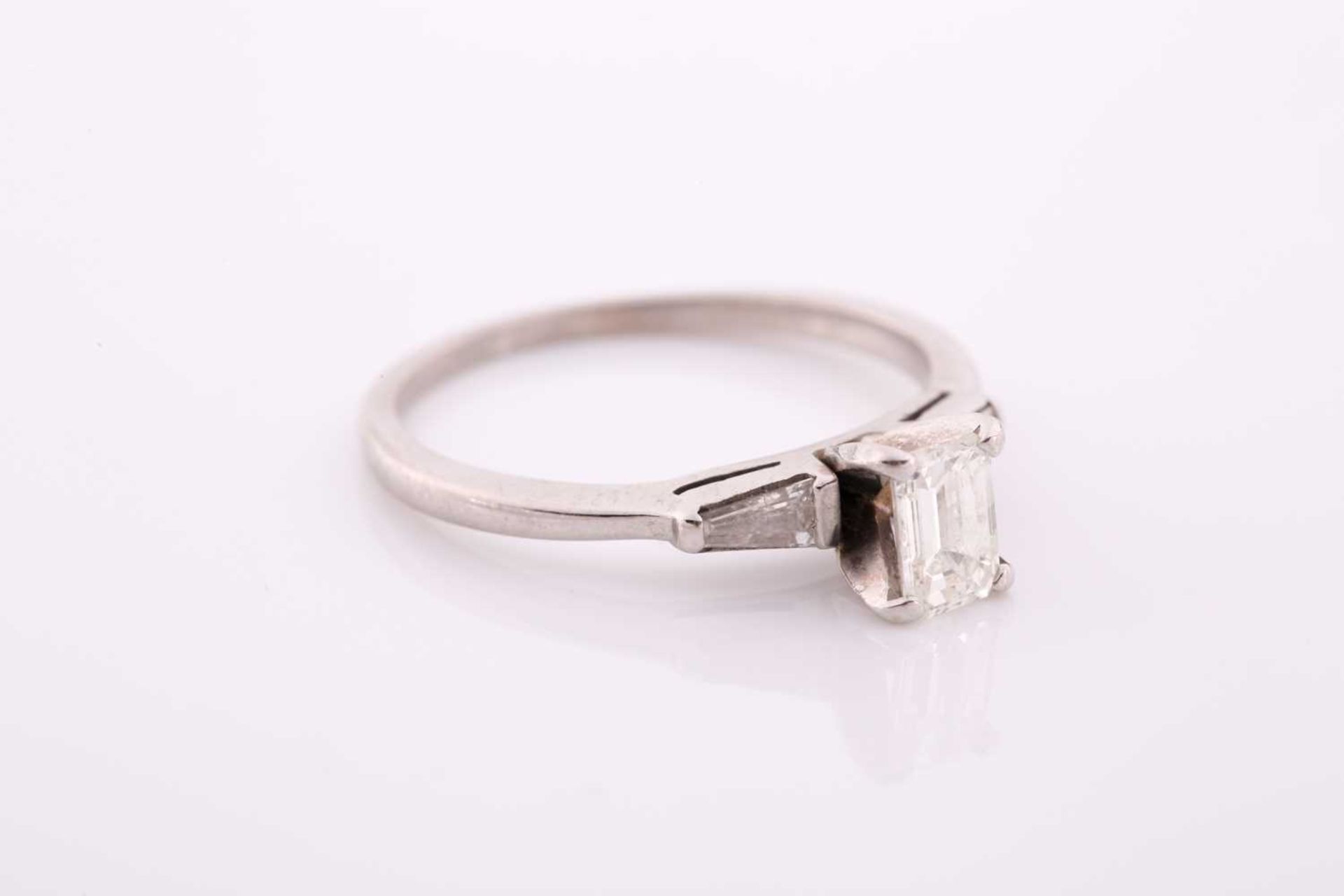 An 18ct white gold and diamond ring, set with an emerald-cut diamond of approximately 0.60 carats, - Image 2 of 4
