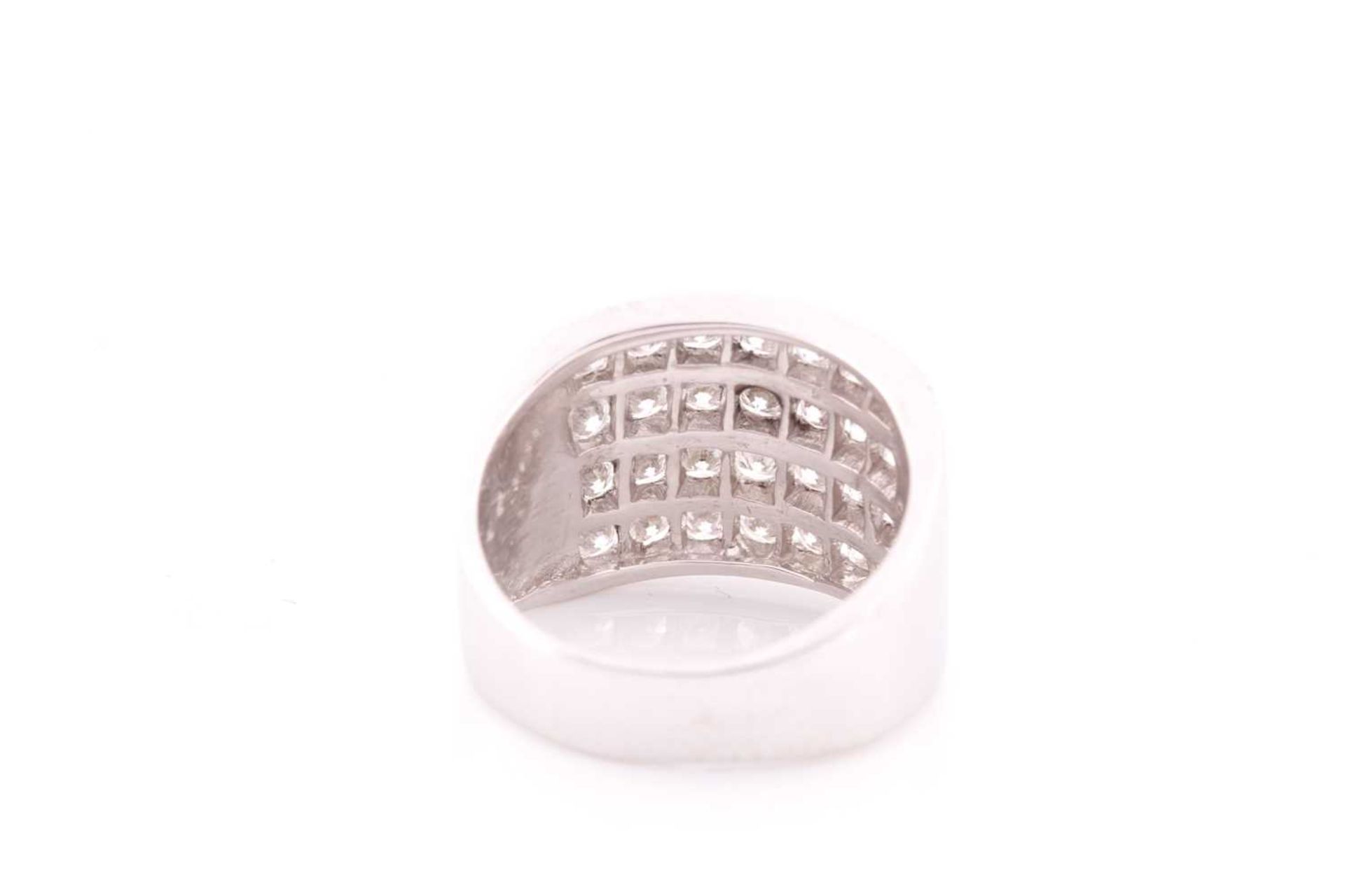 A diamond band ring, channel-set with four rows of round brilliant-cut diamonds of approximately 2. - Image 2 of 4