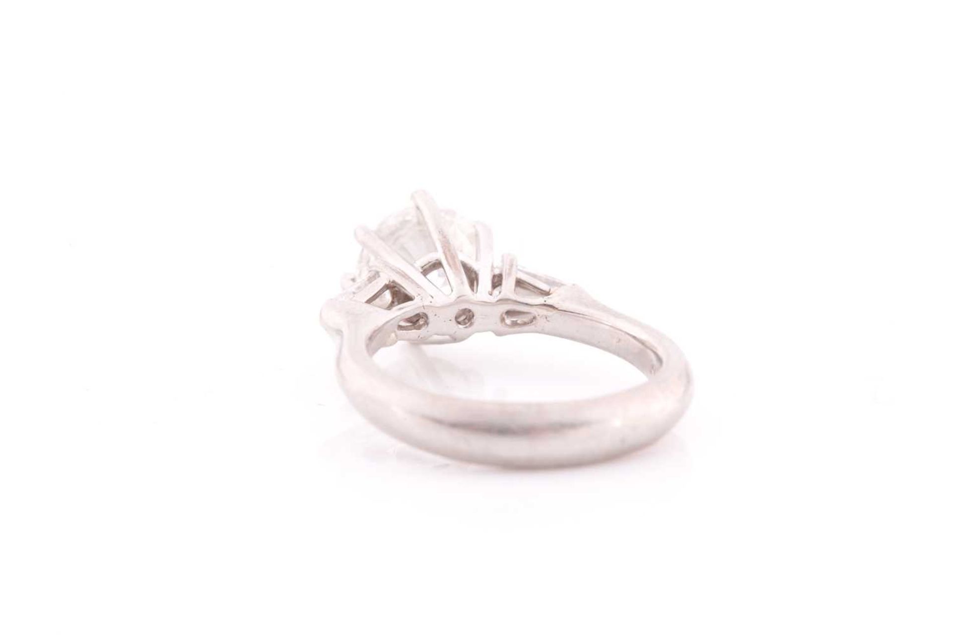 A platinum and diamond ring, set with a round brilliant-cut diamond of approximately 1.50 carats, - Image 2 of 4