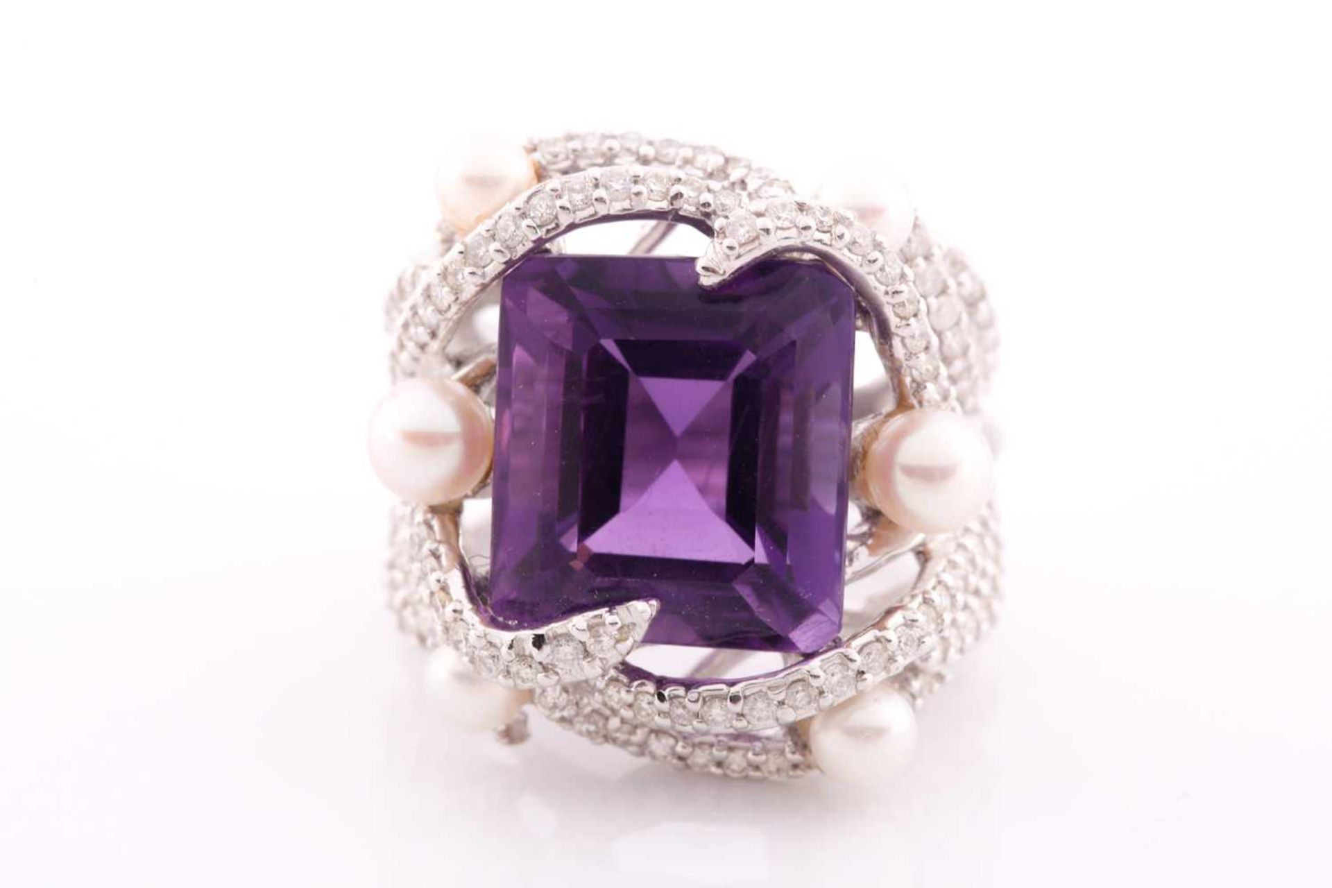 An impressive diamond and amethyst cocktail ring, centred with a mixed square-cut amethyst,