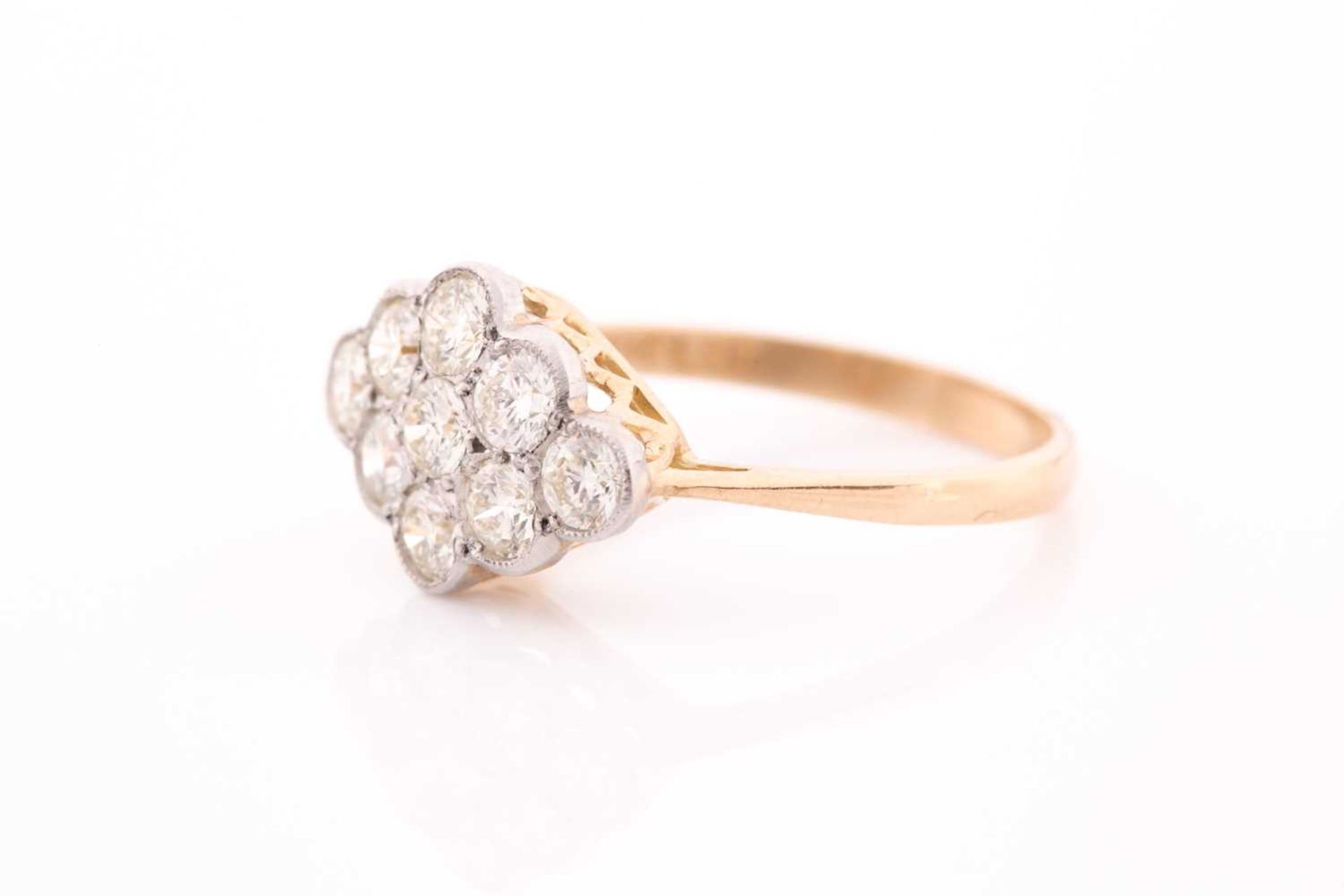 An 18ct yellow gold and diamond ring, set with a cluster of nine round brilliant-cut diamonds of - Image 2 of 4