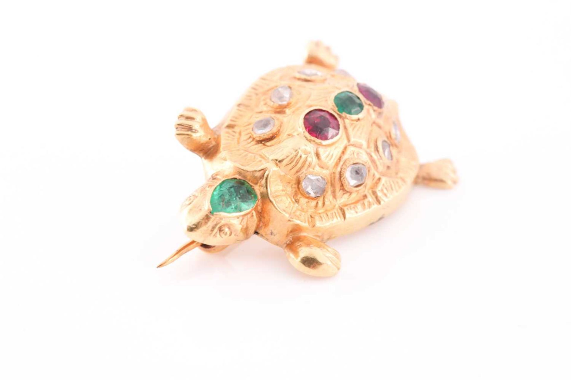 A yellow metal novelty brooch in the form of a turtle, inset with a pear-cut emerald to the head, - Image 3 of 3