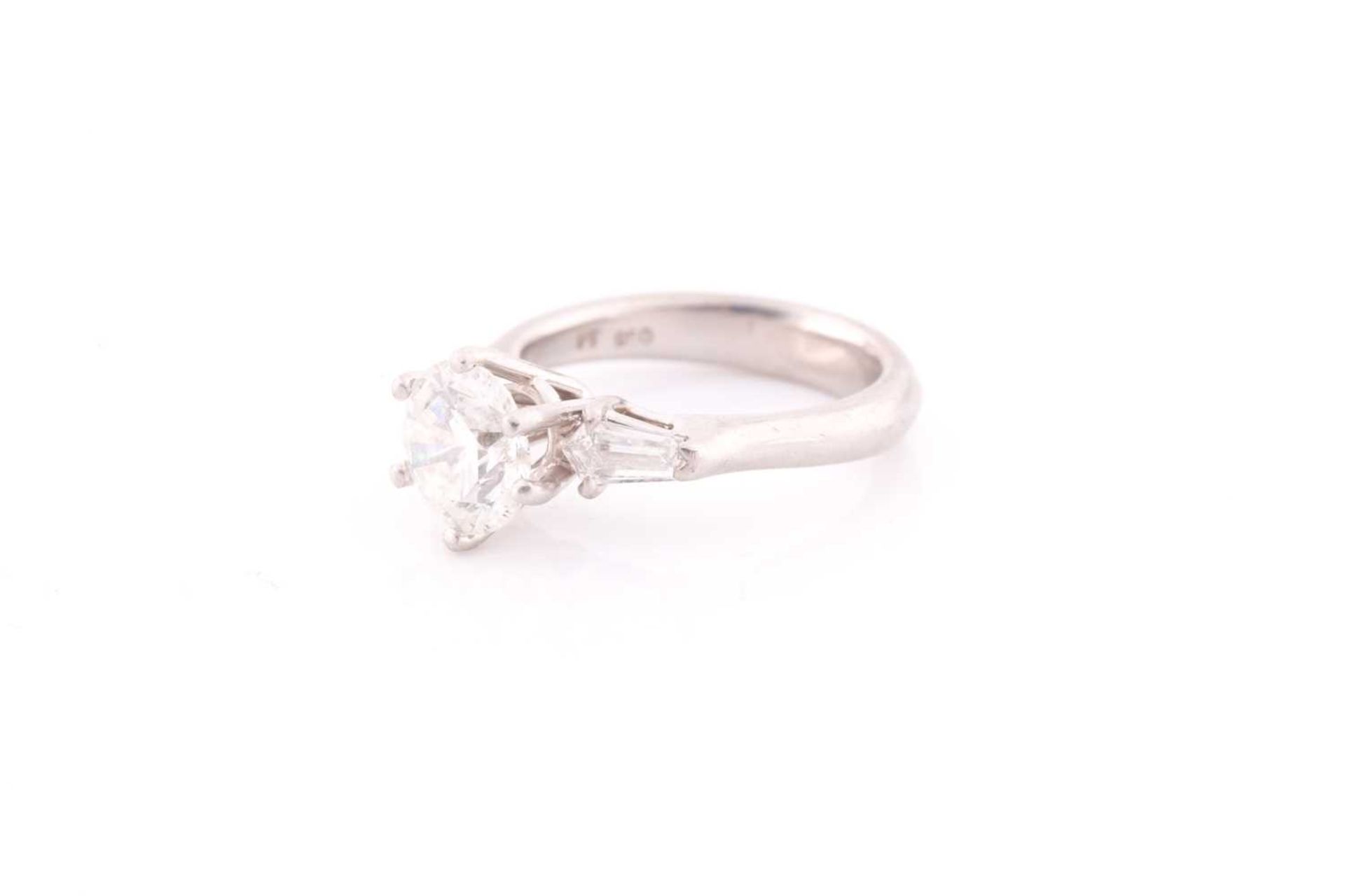 A platinum and diamond ring, set with a round brilliant-cut diamond of approximately 1.50 carats, - Image 3 of 4