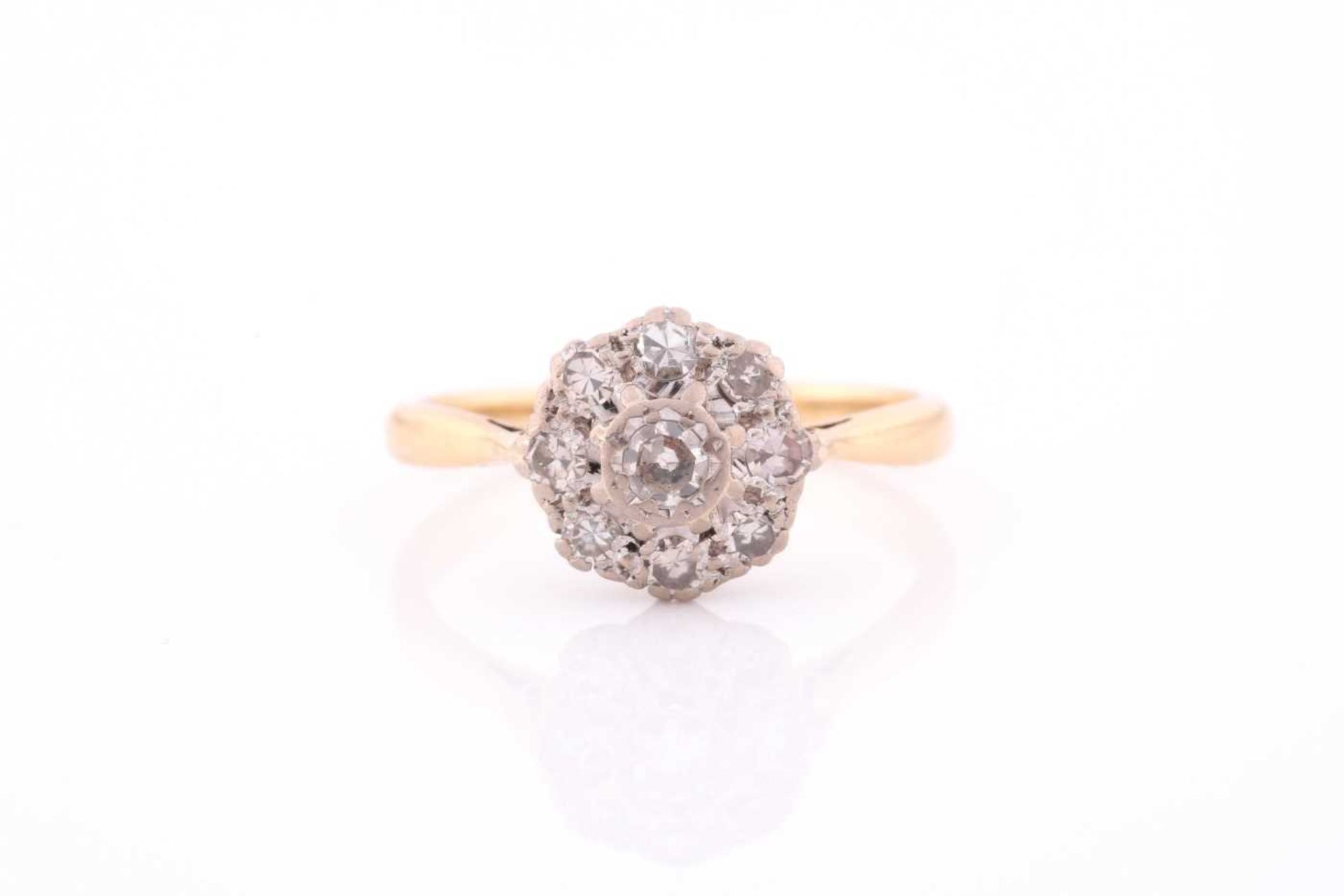 An 18ct yellow gold and diamond cluster ring, set with round eight-cut diamonds, the central stone
