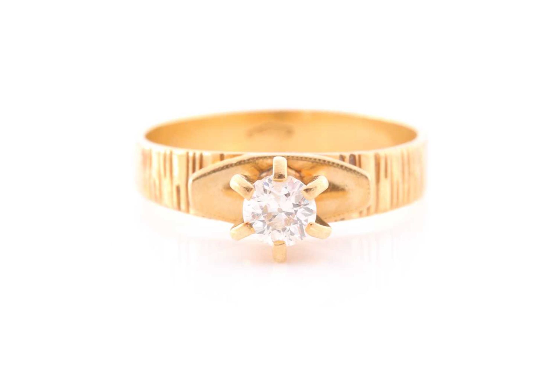 An 18ct yellow gold and diamond ring, set with a round brilliant-cut diamond of approximately 0.40