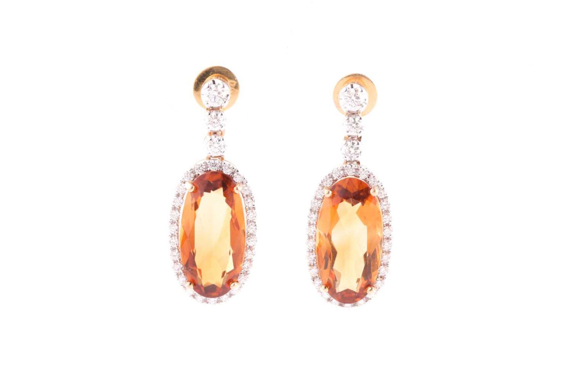 A pair of yellow metal, diamond, and citrine drop earrings, set with mixed oval-cut orange