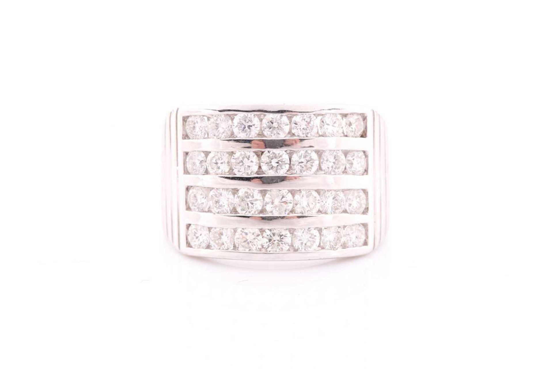 A diamond band ring, channel-set with four rows of round brilliant-cut diamonds of approximately 2.