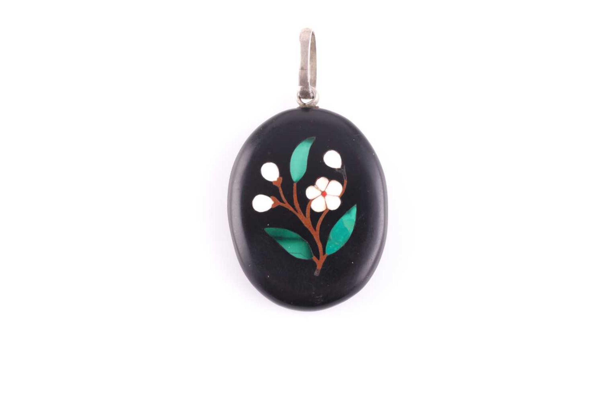 A silver and black hardstone pendant locket, the back inset with a pietra dura design of a flower